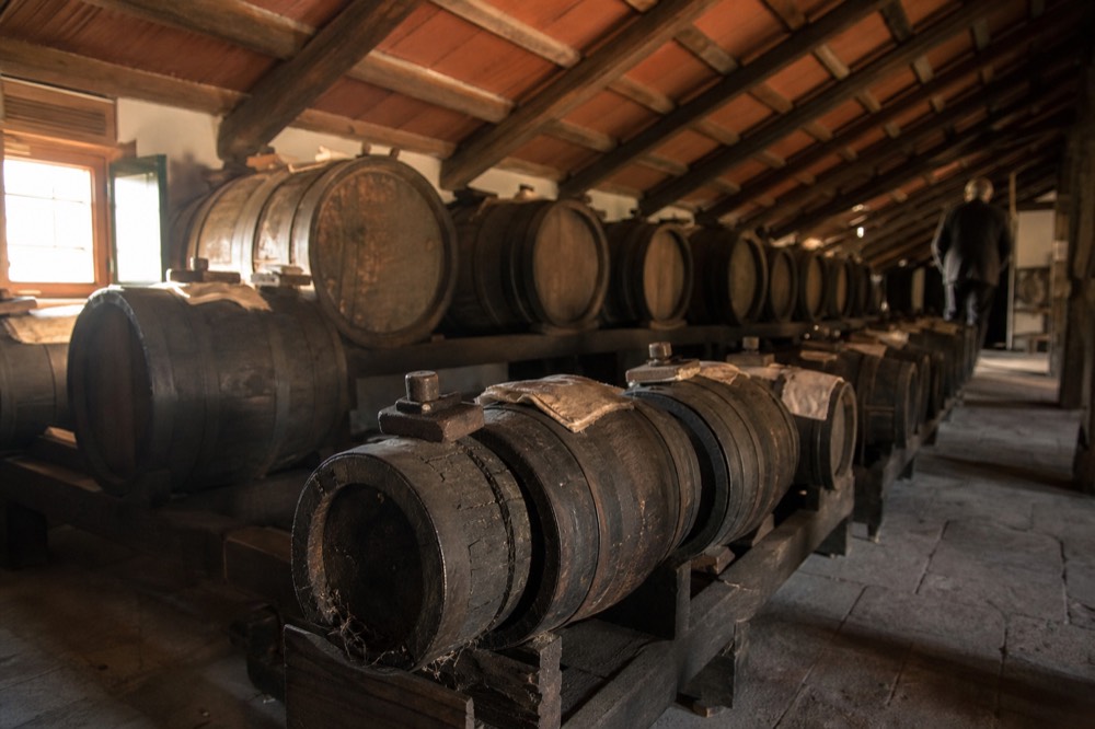 Traditional balsamic vinegar barrels in a Modena acetaia attic