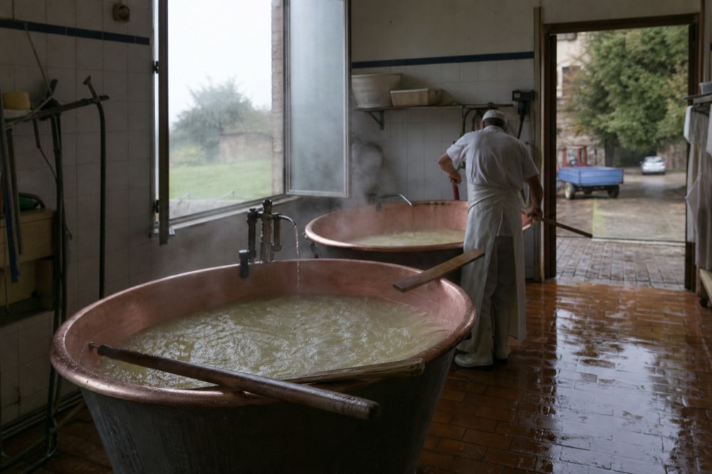 Copper vats and working equipment inside a dairy cheesemaking room
