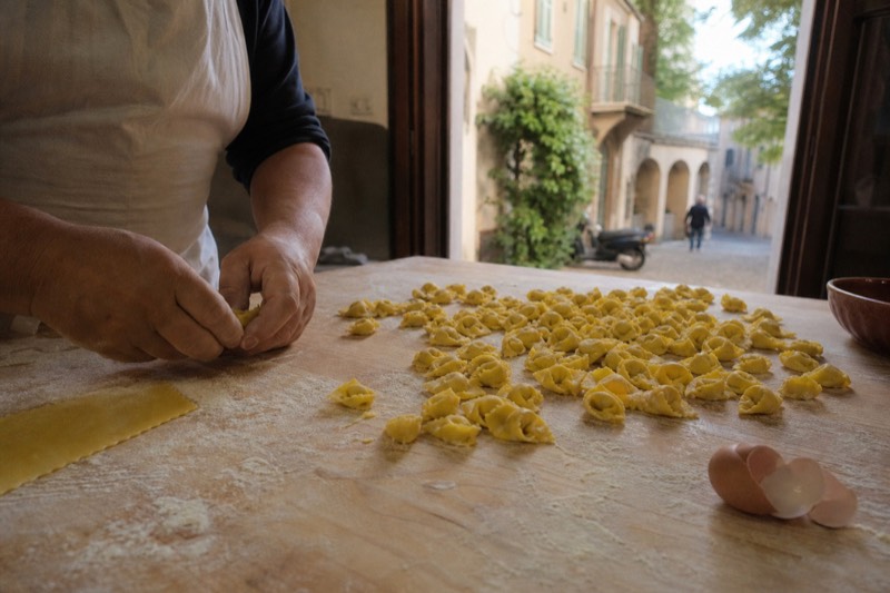Cooking class category card showing fresh pasta being made by hand, for Modena pasta and tiramisu classes
