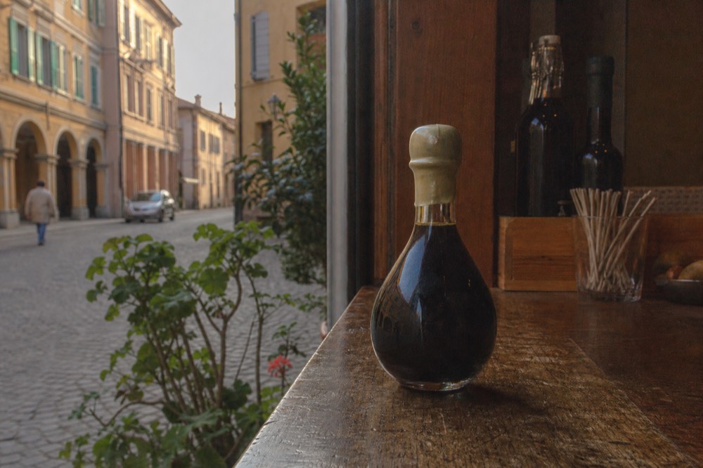Close view of a sealed traditional balsamic bottle with its numbered seal