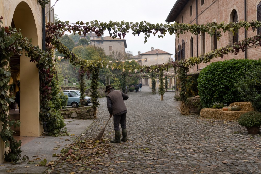 A hilltop wine town street decorated for an autumn grape festival