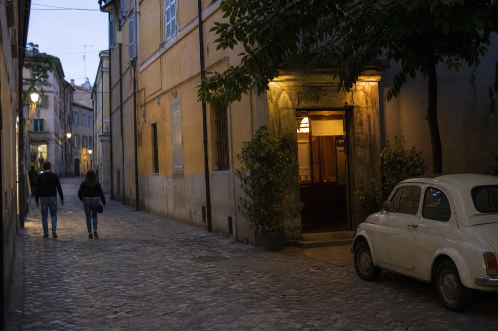The discreet entrance of Osteria Francescana on Via Stella in Modena