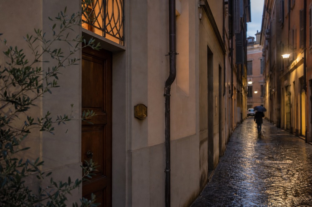 The exterior of Osteria Francescana on Via Stella, a modest door with a small sign